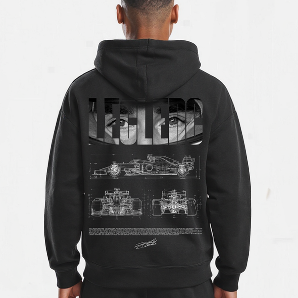 Gros plan sur le design blueprint du sweat noir Charles Leclerc avec vues techniques de la monoplace Ferrari