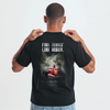 T-shirt noir Spa Grand Prix, vue de face en pied sur mannequin en jean clair et baskets blanches