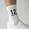 Chaussettes Ayrton Senna 12, saison 1988 blanc, gros plan sur le motif tricoté