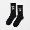 Chaussettes Ayrton Senna 12, saison 1988 noir, la paire posée à plat