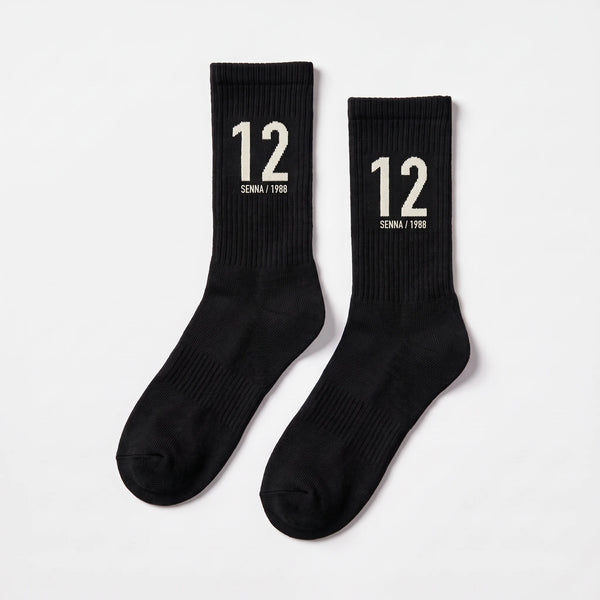 Chaussettes Ayrton Senna 12, saison 1988 noir, la paire posée à plat