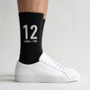 Chaussettes Ayrton Senna 12, saison 1988 noir, gros plan sur le motif tricoté