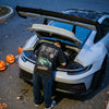 The Ghost RS washed T-shirt worn, leaning over the rear engine of a GT3 RS on Halloween night
