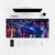 Mousepad Nissan Skyline GT R R34, sobre uma mesa clara com computador, teclado e mouse