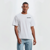 T-shirt blanc Esteban Ocon porté par mannequin, logo Tourismo imprimé côté cœur