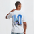 T-shirt blanc F1 Pierre Gasly avec grand numéro 10 bleu et illustration du pilote en combinaison Alpine sur le dos